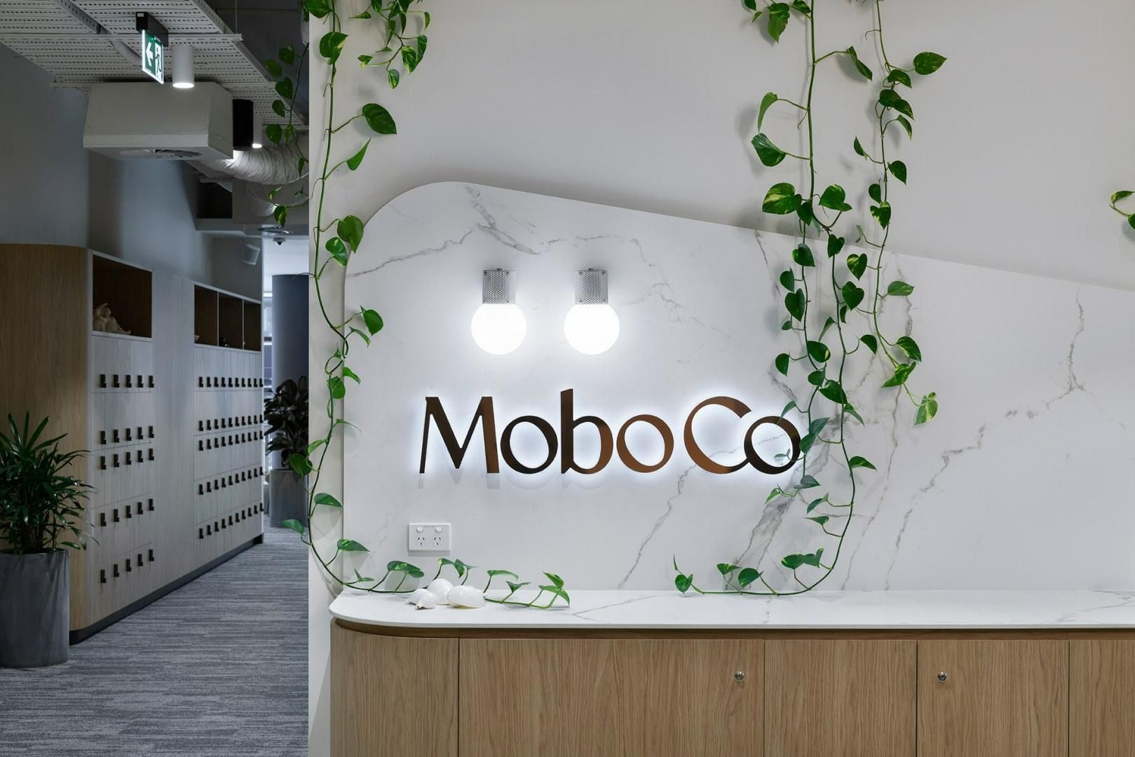 A Lobby with A Mobo Co Sign on The Wall — Thats Tops by Design in Taminda, NSW
