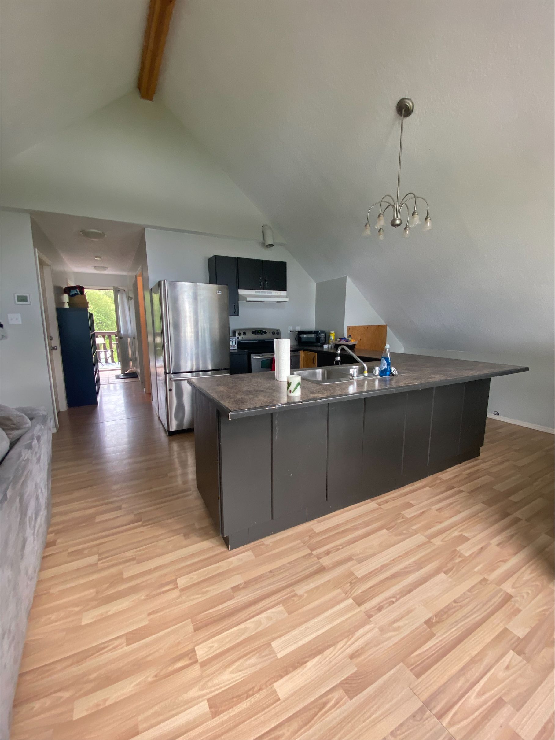 A kitchen with a large island in the middle of the room.