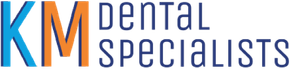 A blue and white logo for km dental specialists