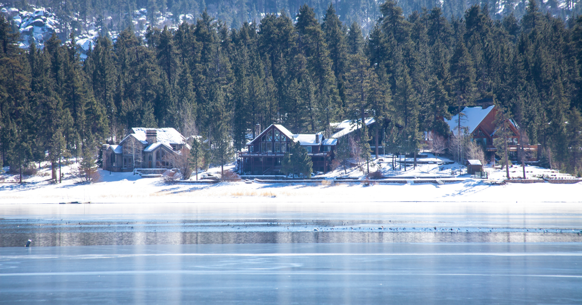 Snow covered cabins along an icy Big Bear Lake Snow covered cabins along an icy Big Bear Lake