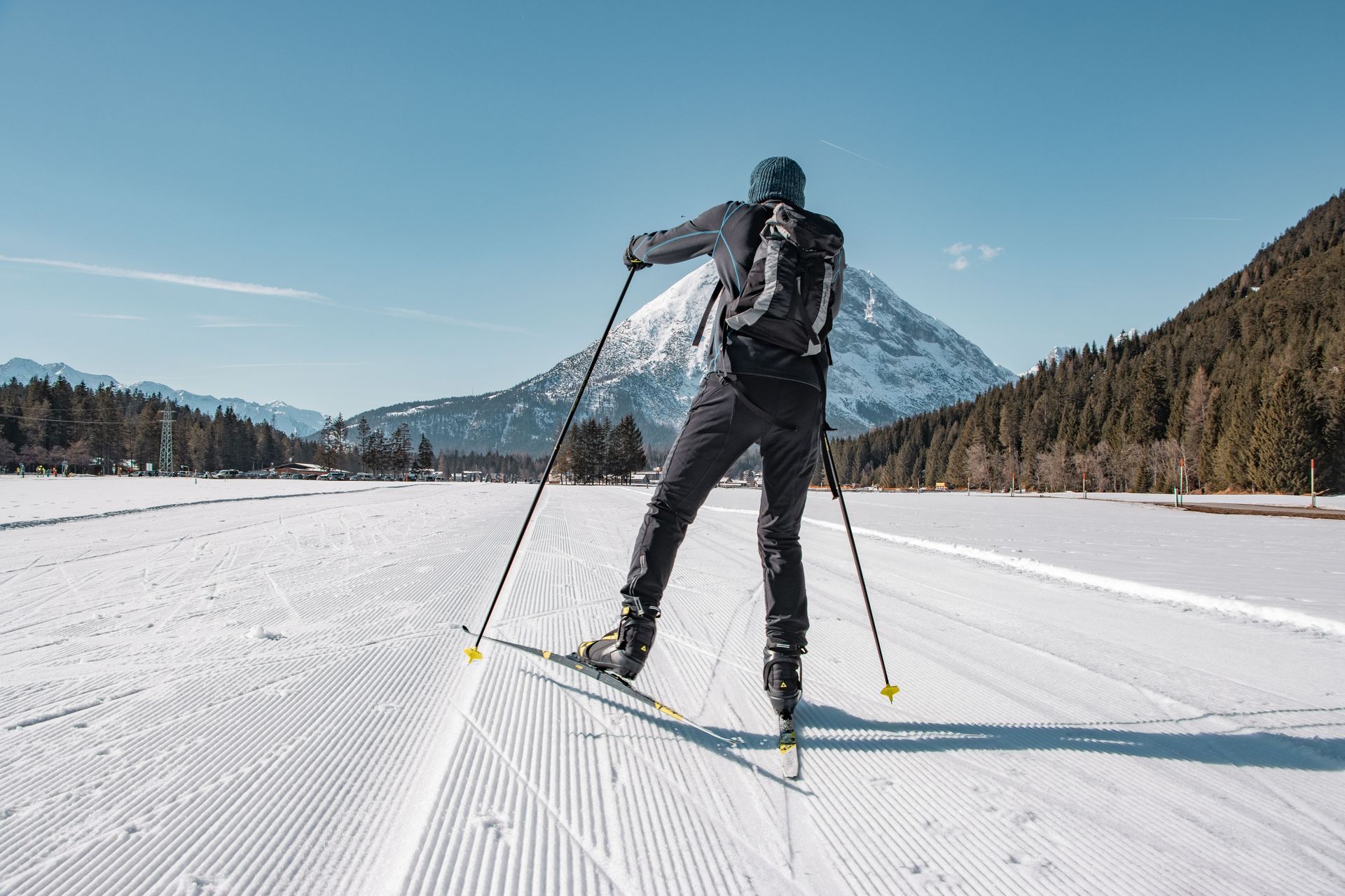 Cross-country skiing through snowy forest terrain near Big Bear