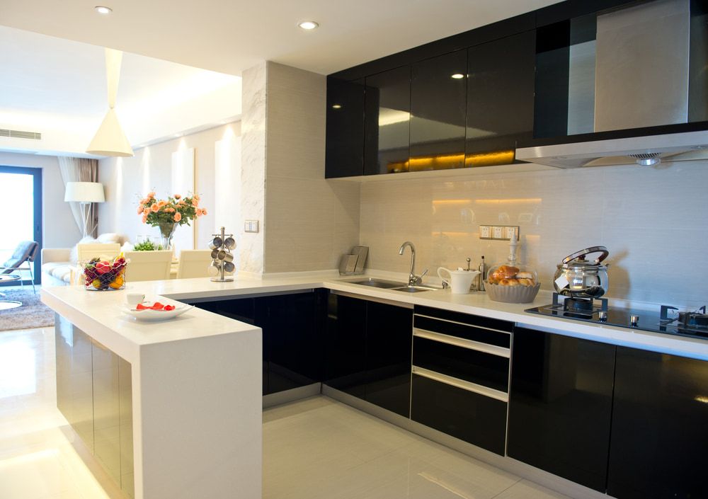 Kitchen With Black Cabinets and White Counter Tops — Happy Housekeepers in South Tamworth, NSW
