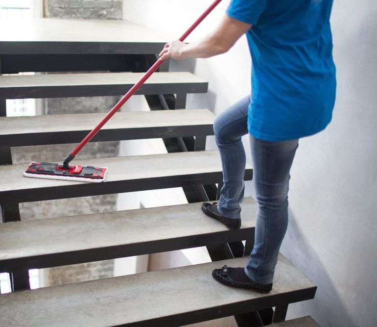 Person is Cleaning the Stairs — Happy Housekeepers in Manilla, NSW