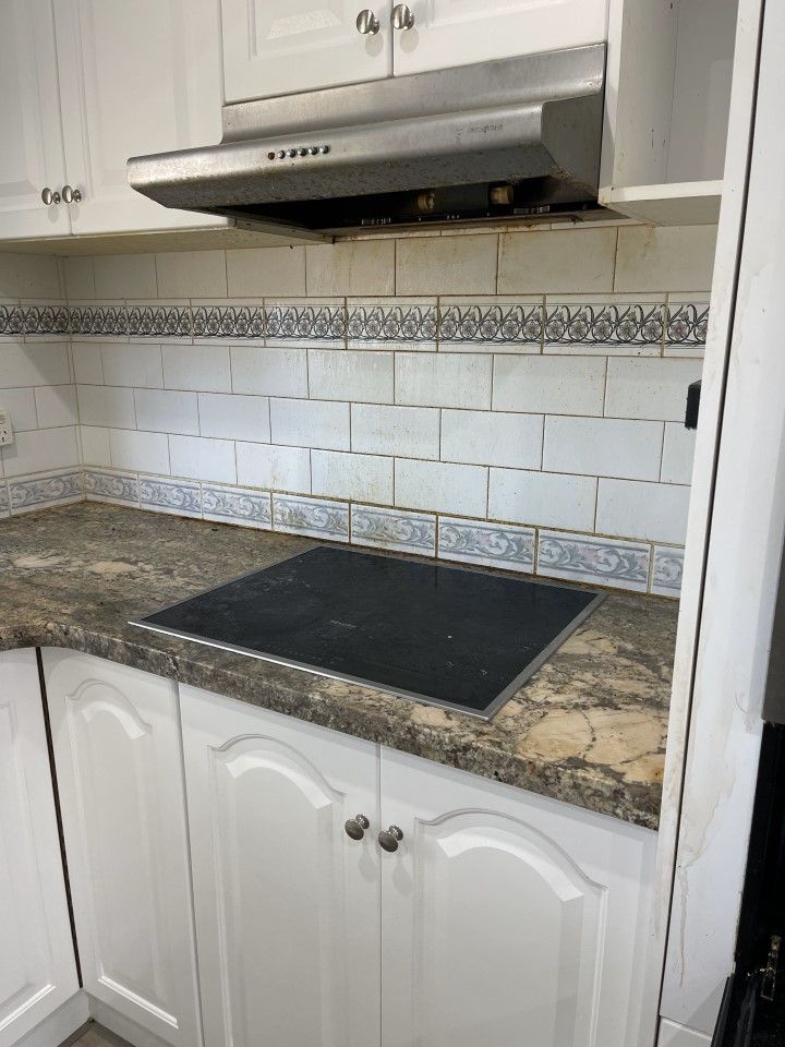 Kitchen With a Stove Top Oven — Happy Housekeepers in South Tamworth, NSW