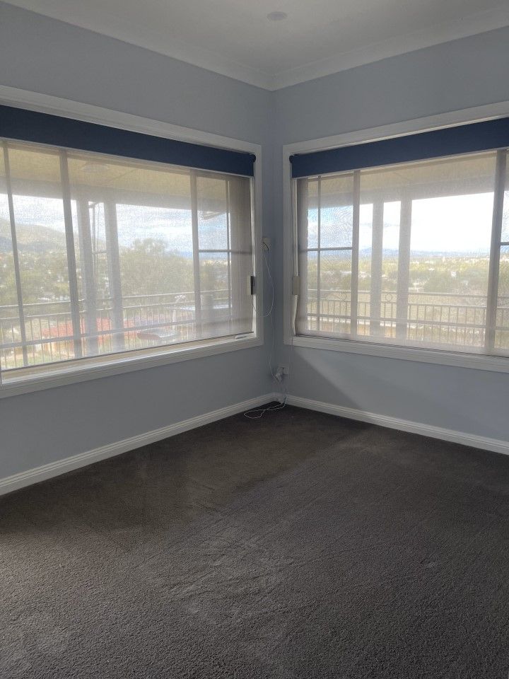 Empty Room With Two Windows and a Carpeted Floor — Happy Housekeepers in South Tamworth, NSW