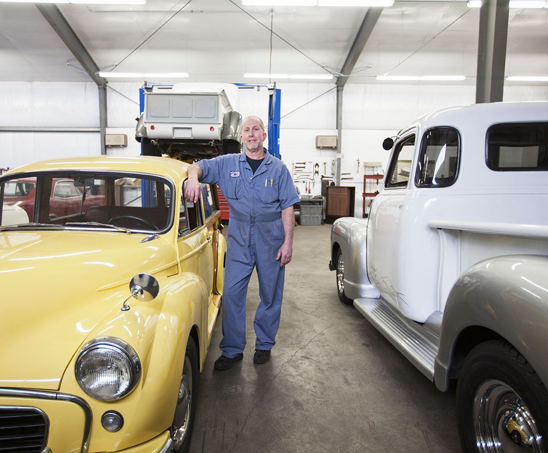 Portrait of a senior male auto shop owner.