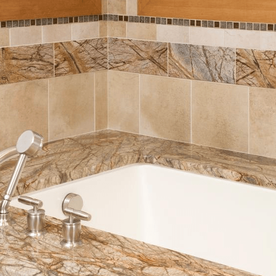A bathtub with a shower head on top of it