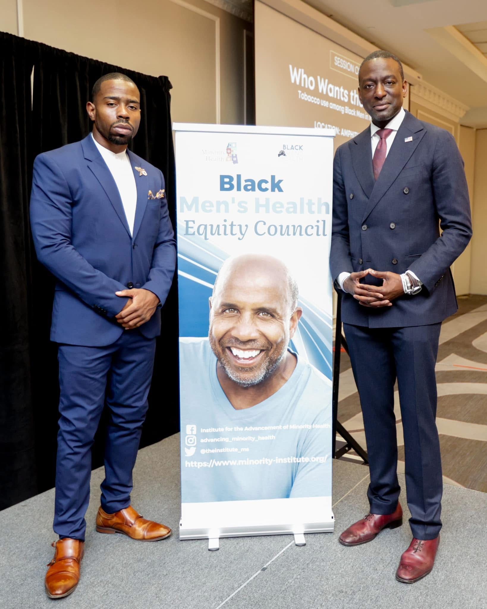 Two men in suits stand by a
