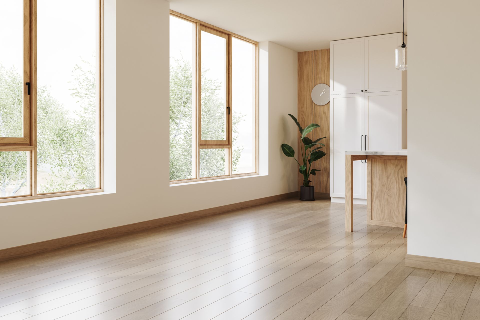 Bright modern kitchen with dark island, large windows, brick accents, and warm wood flooring