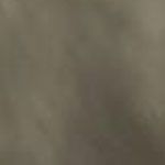 Close-up of a blurry brown surface with soft color gradients