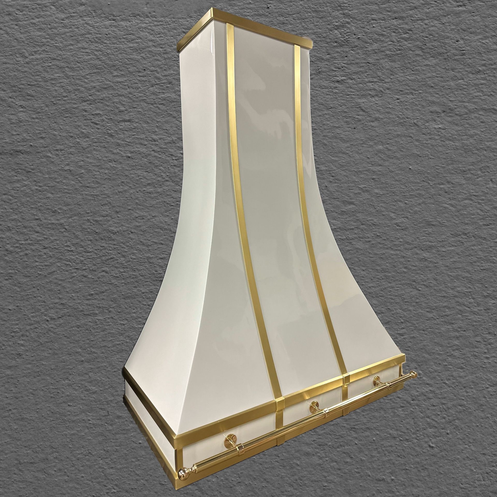 White and gold tapered decorative lamp or sconce on a gray background