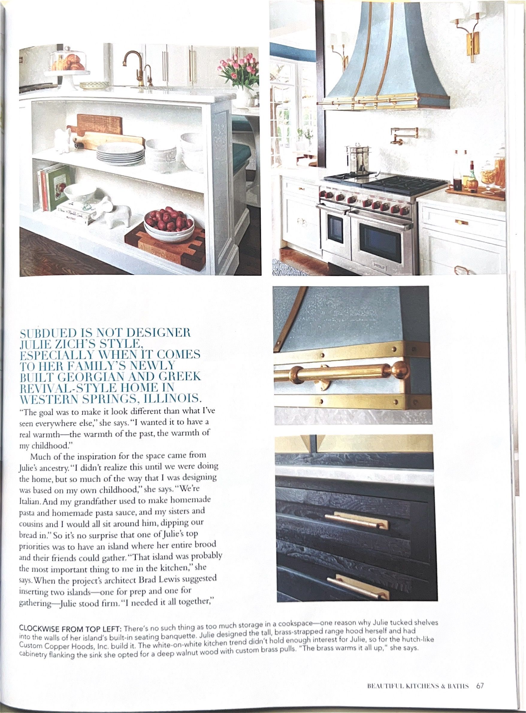 Magazine page showing a white kitchen shelf with decor and a blue range beside drawers and baskets