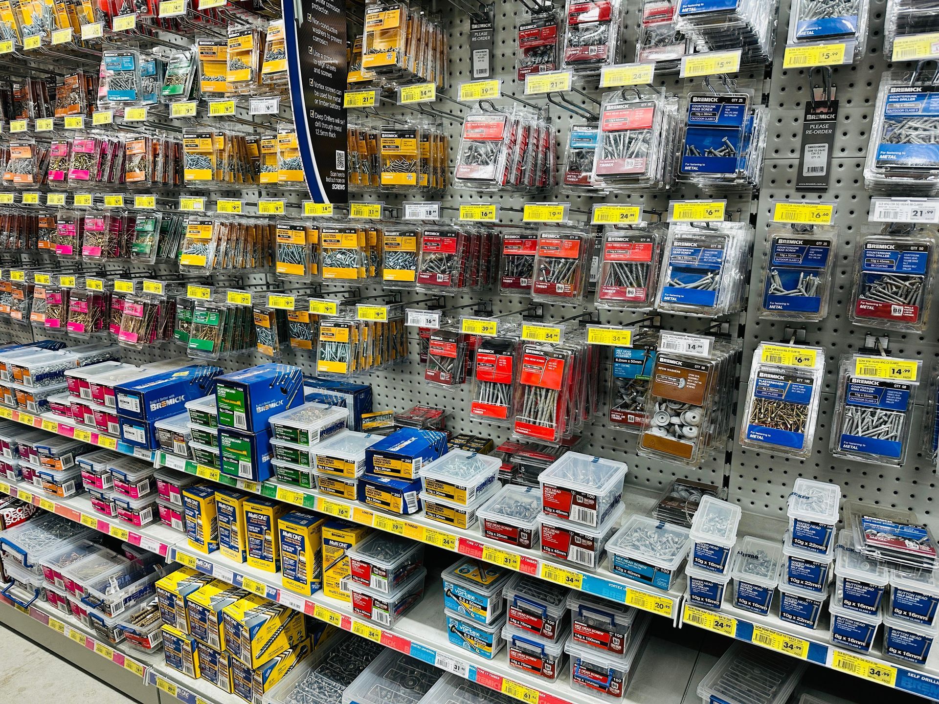 A Store Shelf Filled With Lots Of Different Types Of Screws — Laurieton Warehouse in Laurieton, NSW