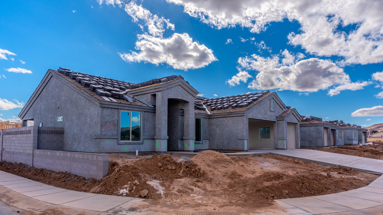 A house is being built in a residential area with a lot of dirt in front of it built by Blue Heron Construction Cape Coral