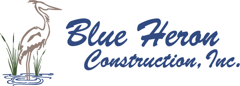 The logo for blue heron construction inc. shows a heron in the water.