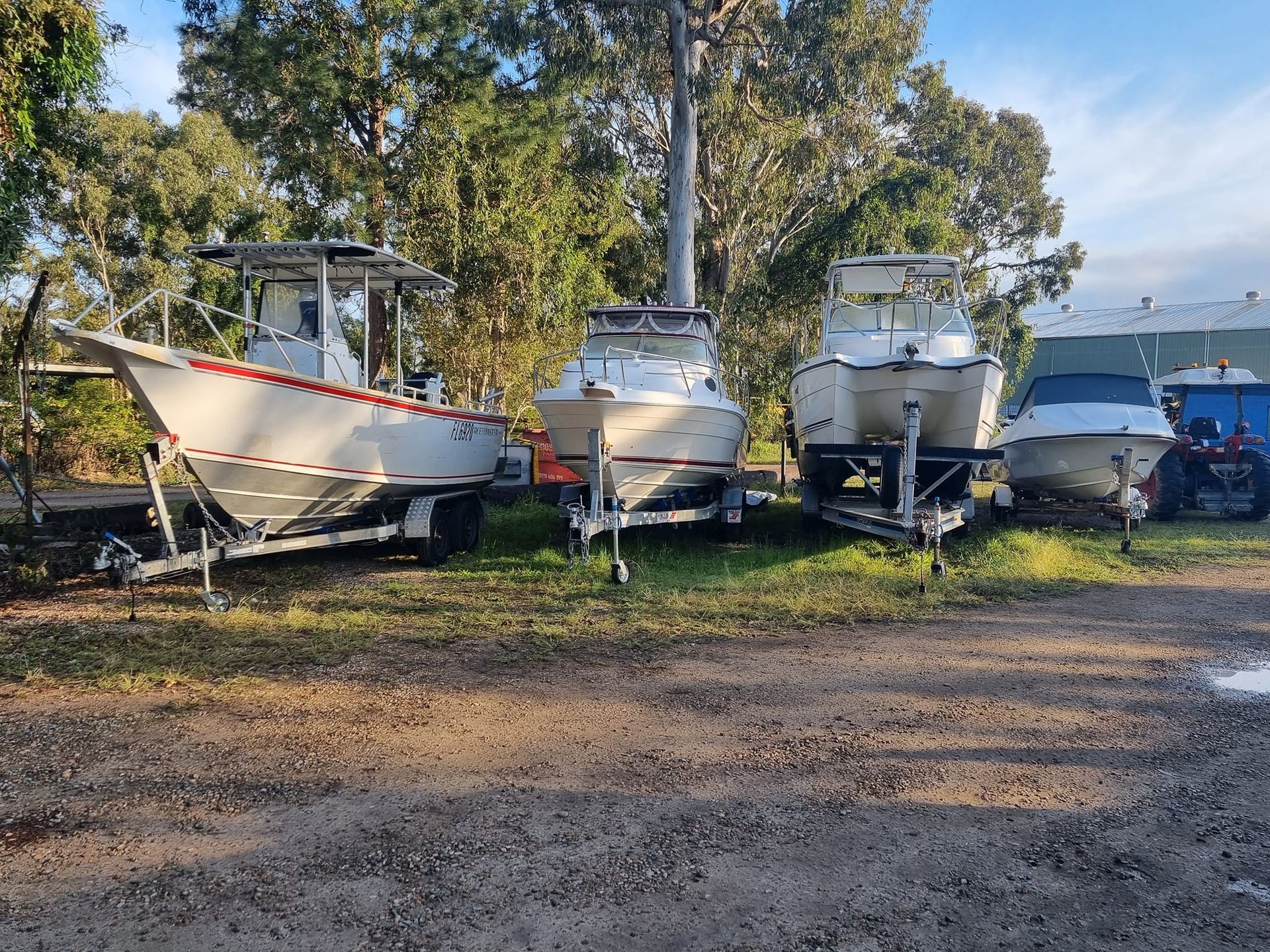 Two outboard motors are sitting on top of a boat in the water.
