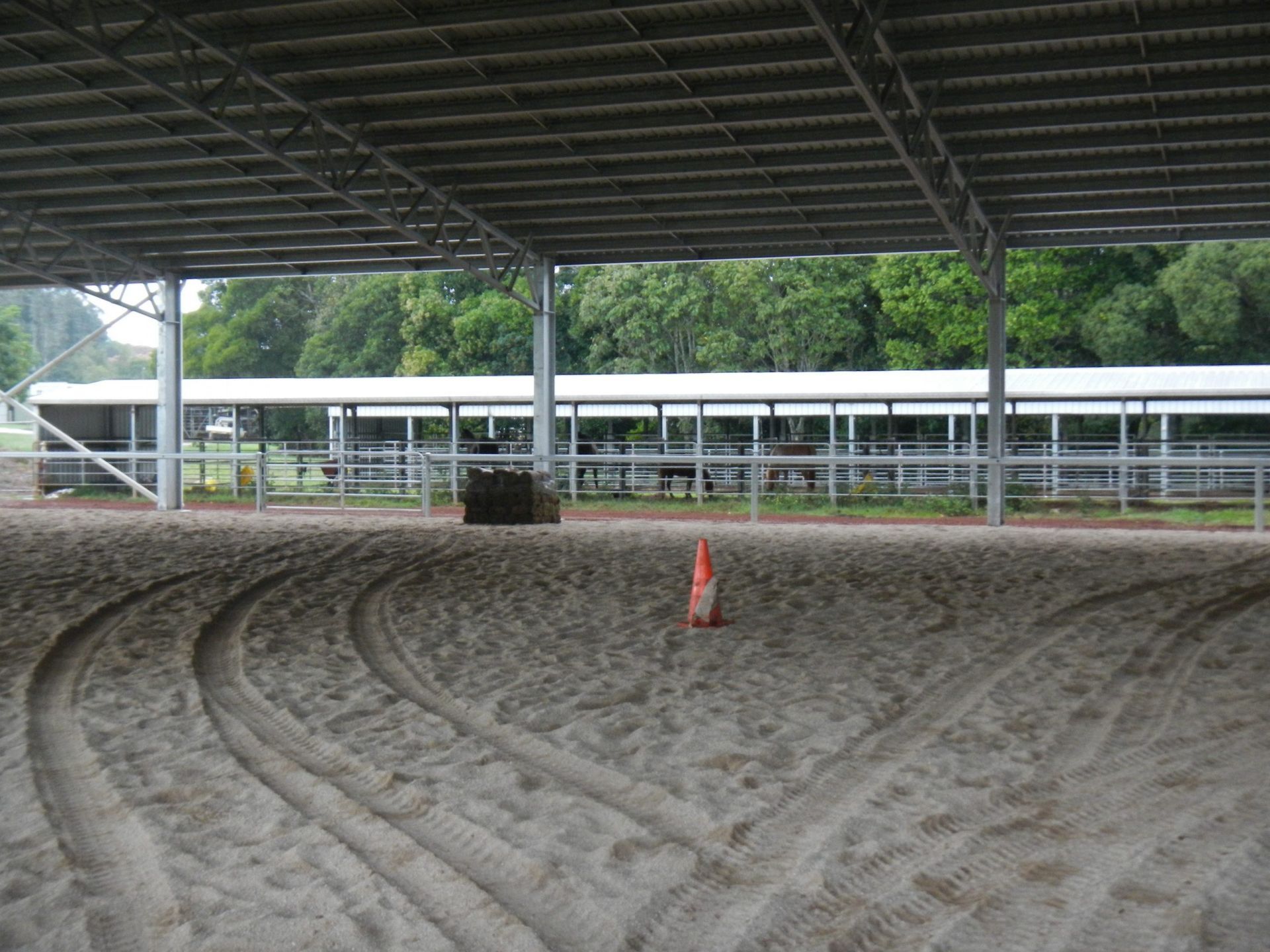 Two Dump Trucks Unloading Gravel At A Construction Site — Evans Earthmoving Contractors In Malanda, QLD 