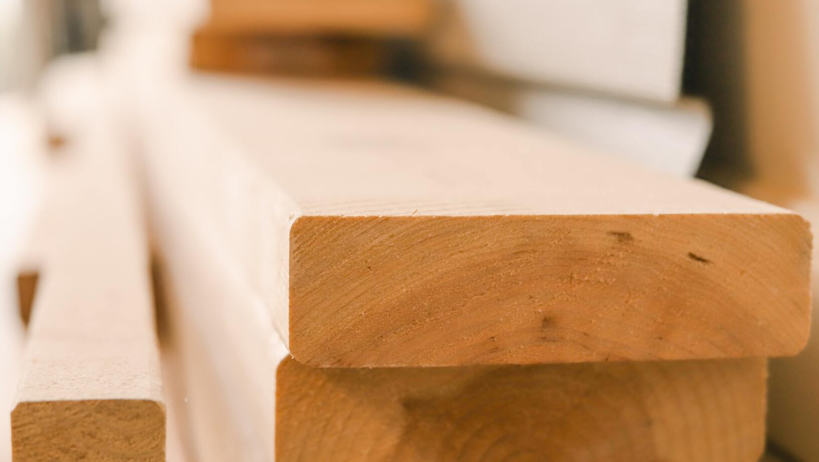 A stack of wooden blocks sitting on top of each other on a table.