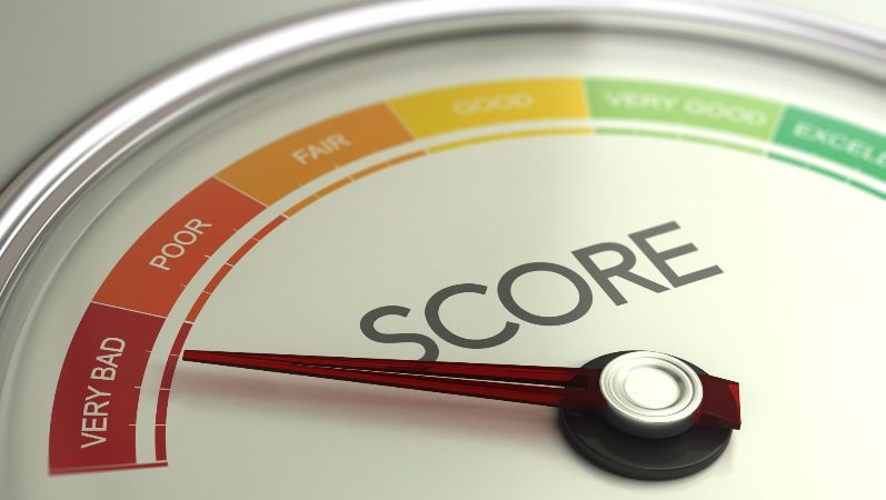 A close up of a speedometer with the word score on it