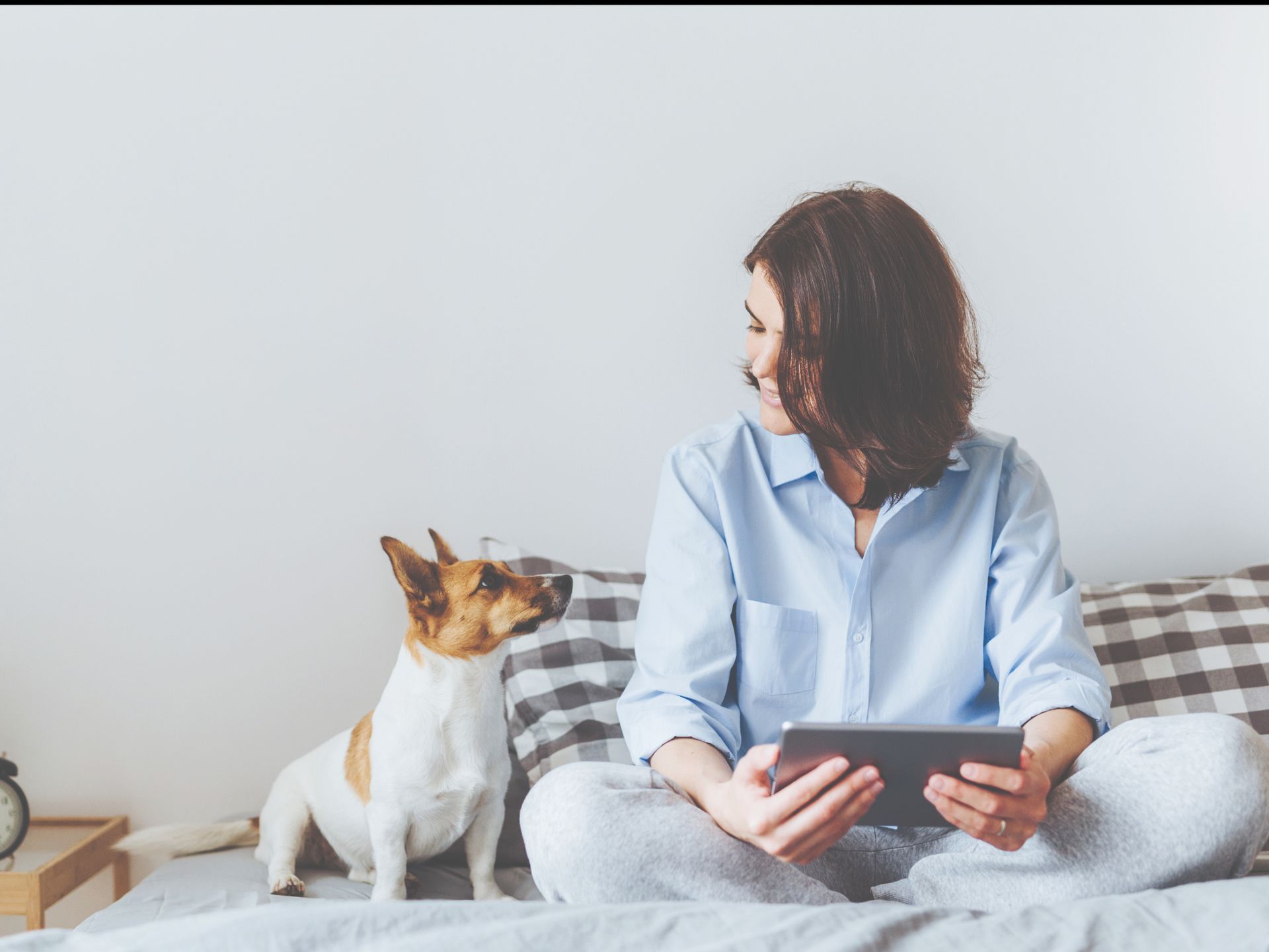 Woman with pet dog at Woodview at Randolph.