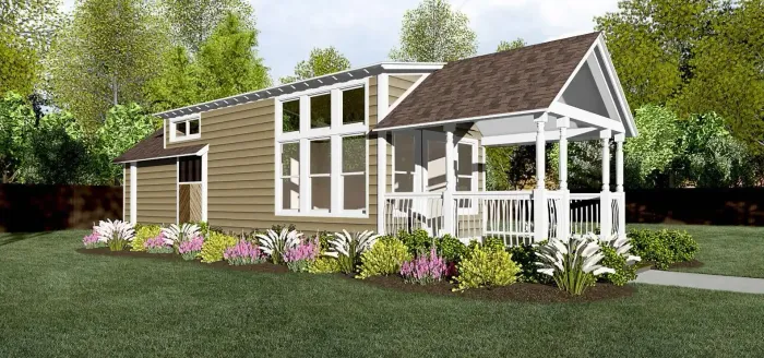 A small house with a porch, windows, and a flower garden.