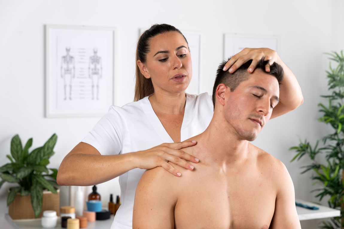 A man is getting a massage from a woman in a spa.