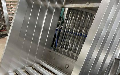 Metal worker creating steel pipes