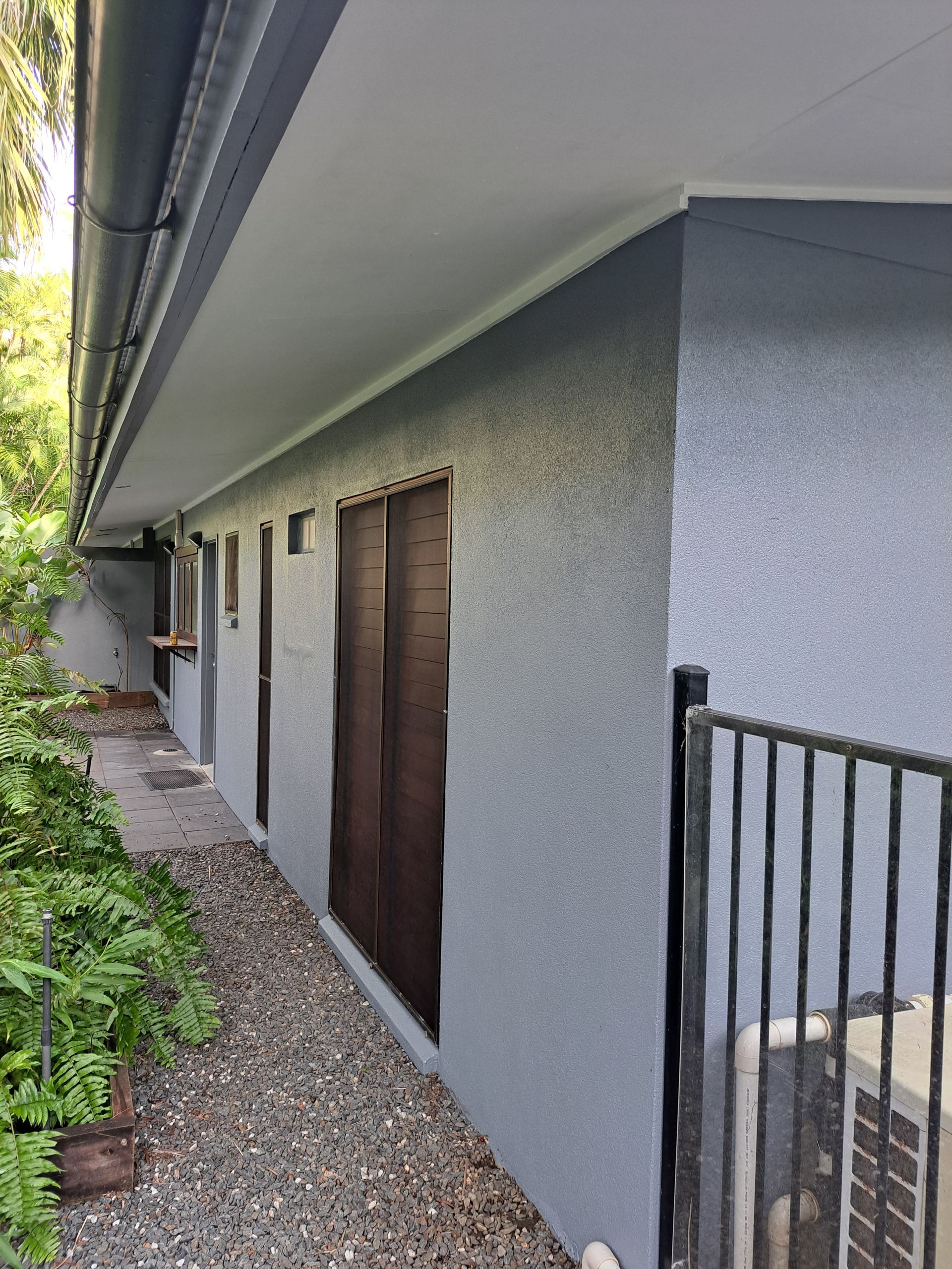 Two Workers Plastering the Exterior Wall of a House — AB QUICK Painting & Maintenance Services In Mareeba, QLD