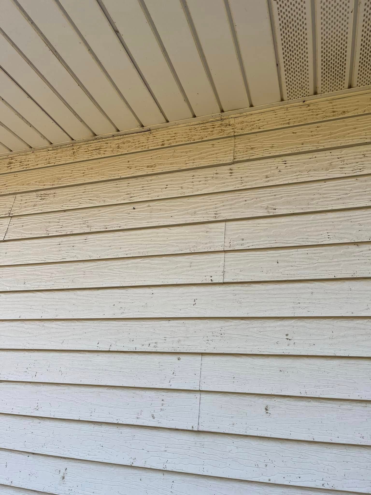 A close up of a white siding on a house