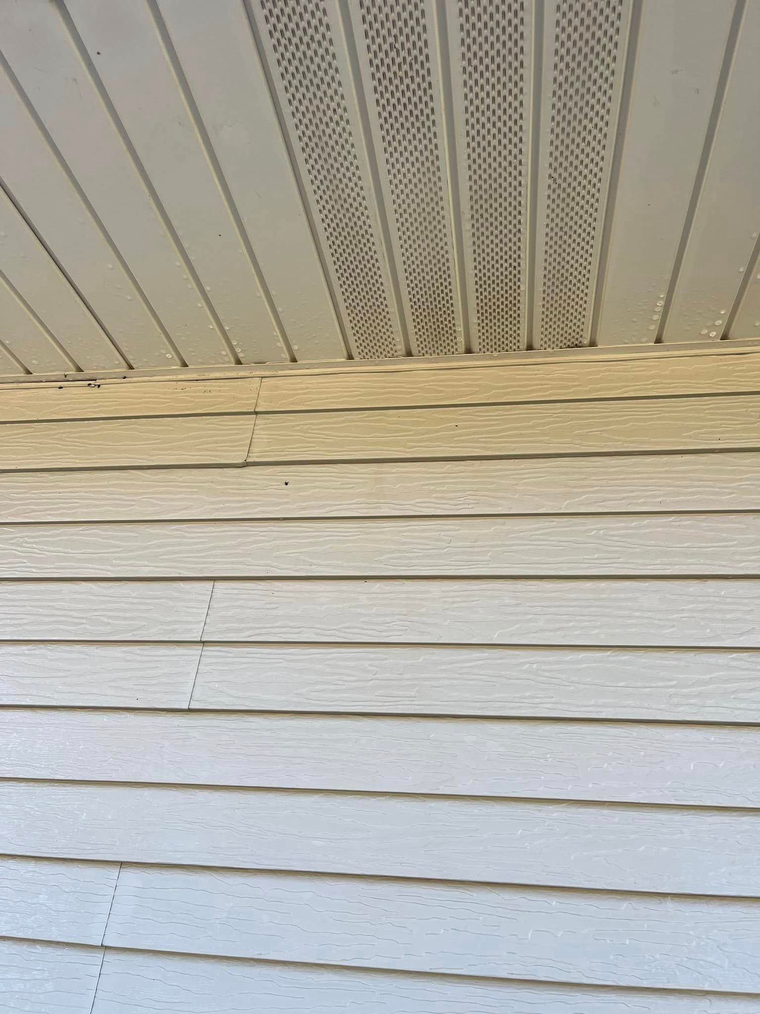 A close up of a house 's siding and ceiling.