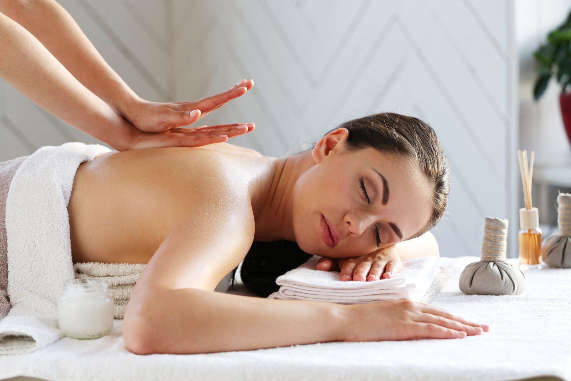 A woman is getting a massage at a spa.