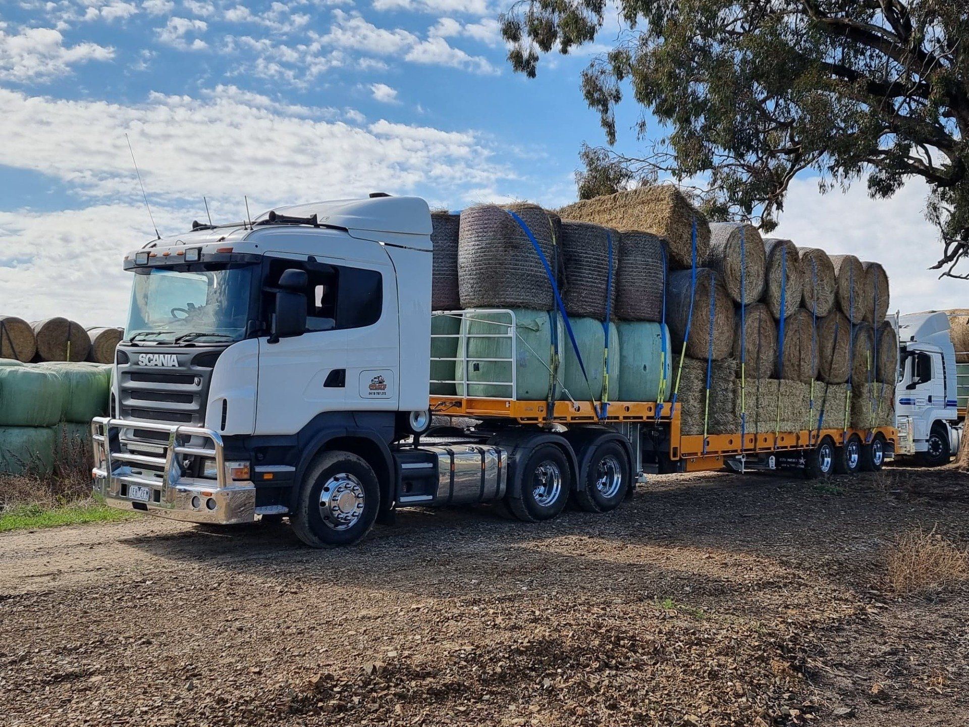 Hay bales loaded onto large truck