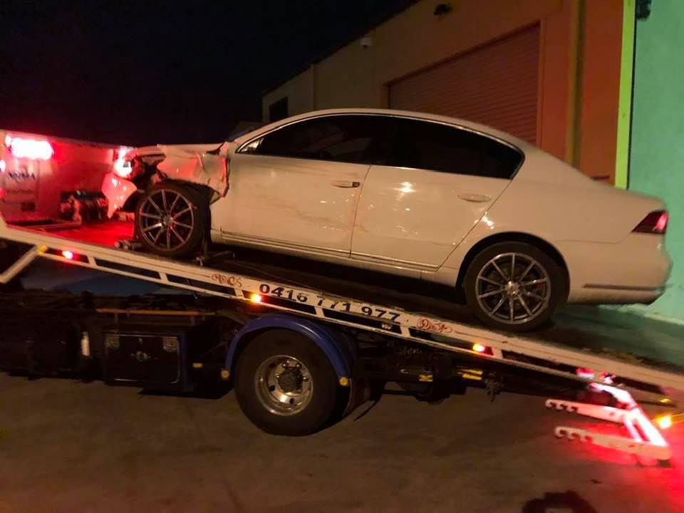 A White Car Is Sitting on Top of A Tow Truck — Twin Lakes Towing & Recovery in Lake Macquarie, NSW