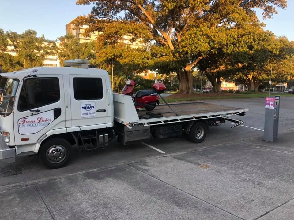 A White Tow Truck Is Parked in A Parking Lot — Twin Lakes Towing & Recovery in Hamlyn Terrace, NSW