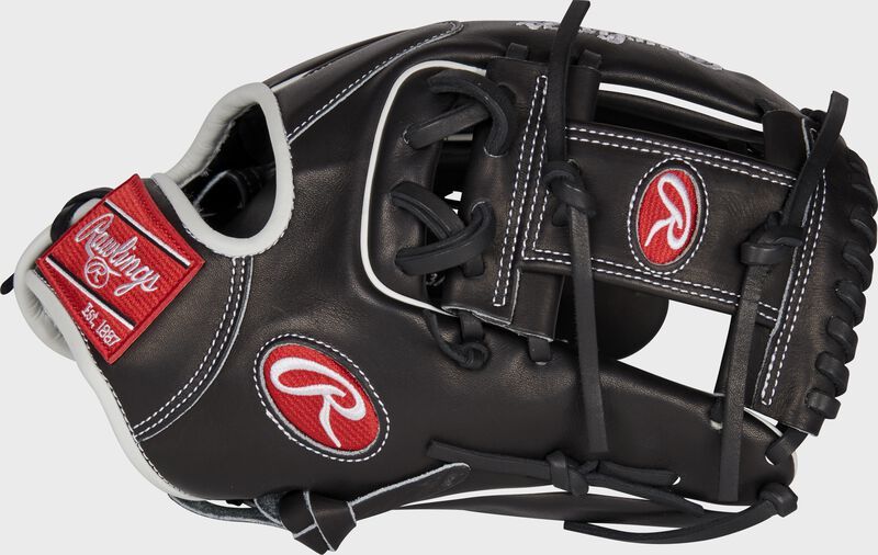 A black baseball glove with the letter r on it