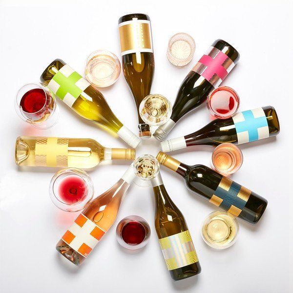 Save our Souls wine bottles and glasses arranged in a circle, of various colors.