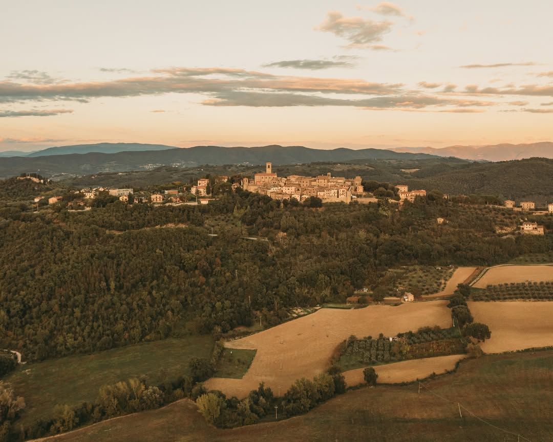 Hilltop village and surrounding countryside near Agri Segretum at sunset.
