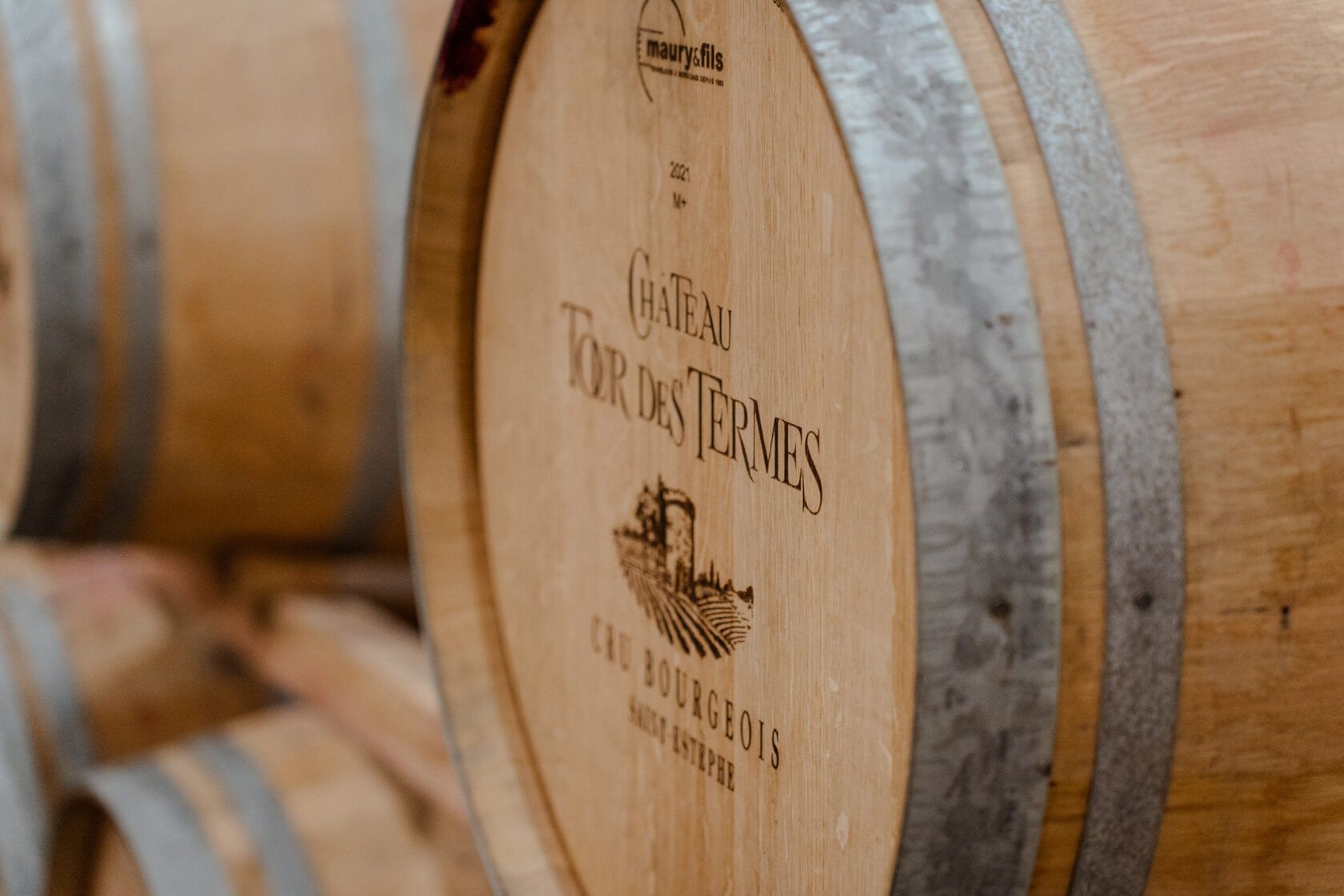 Wooden wine barrels at Château Tour des Termes.