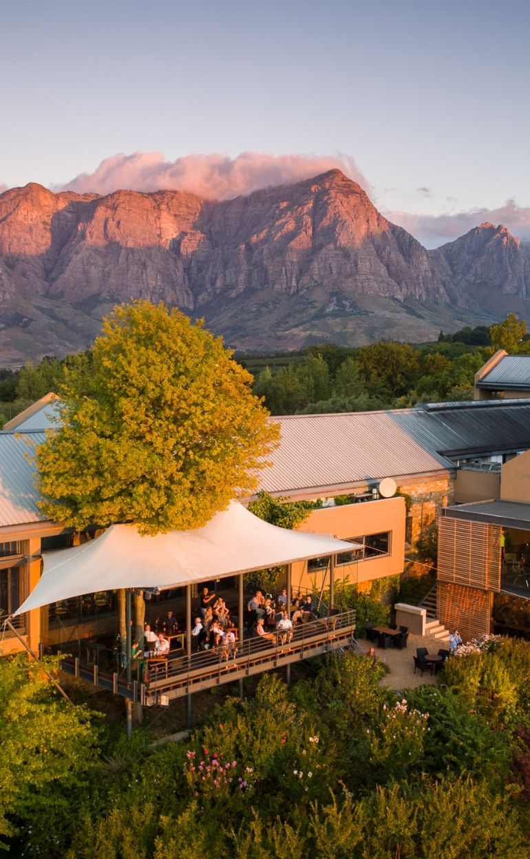 Restaurant patio of Tokara overlooking mountains at sunset.