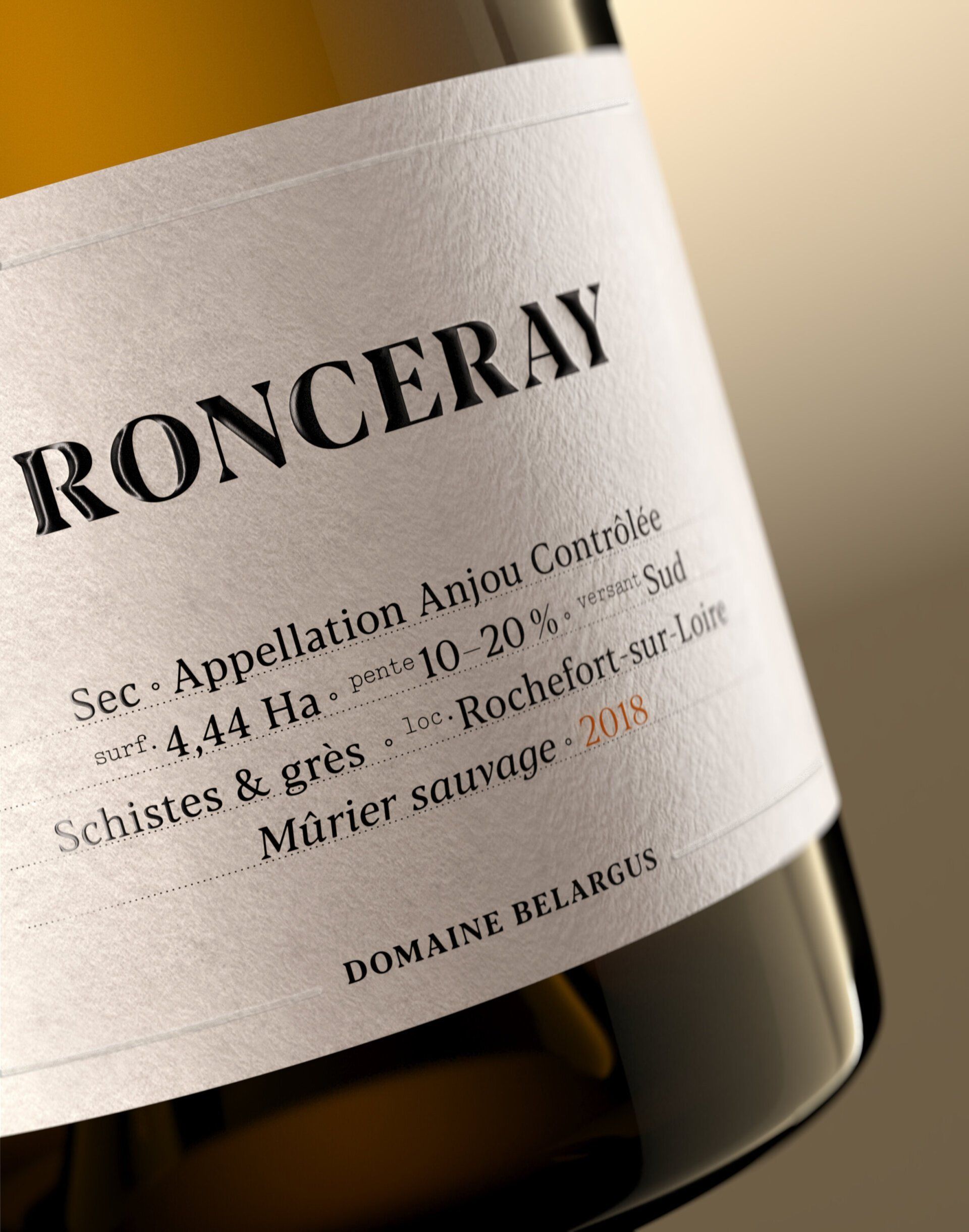 Close-up of a white wine bottle label with the name 