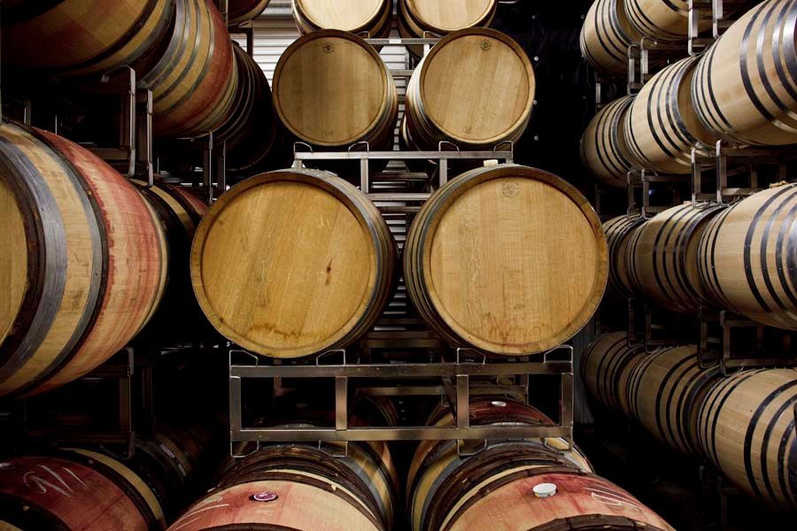 Wine barrels stacked in Sandhi cellar