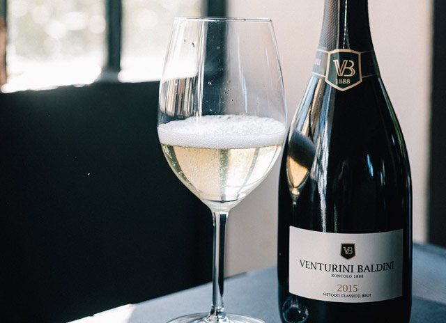 Venturini Baldini Metodo Classico sparkling wine served in glass, highlighting elegance and craftsmanship.