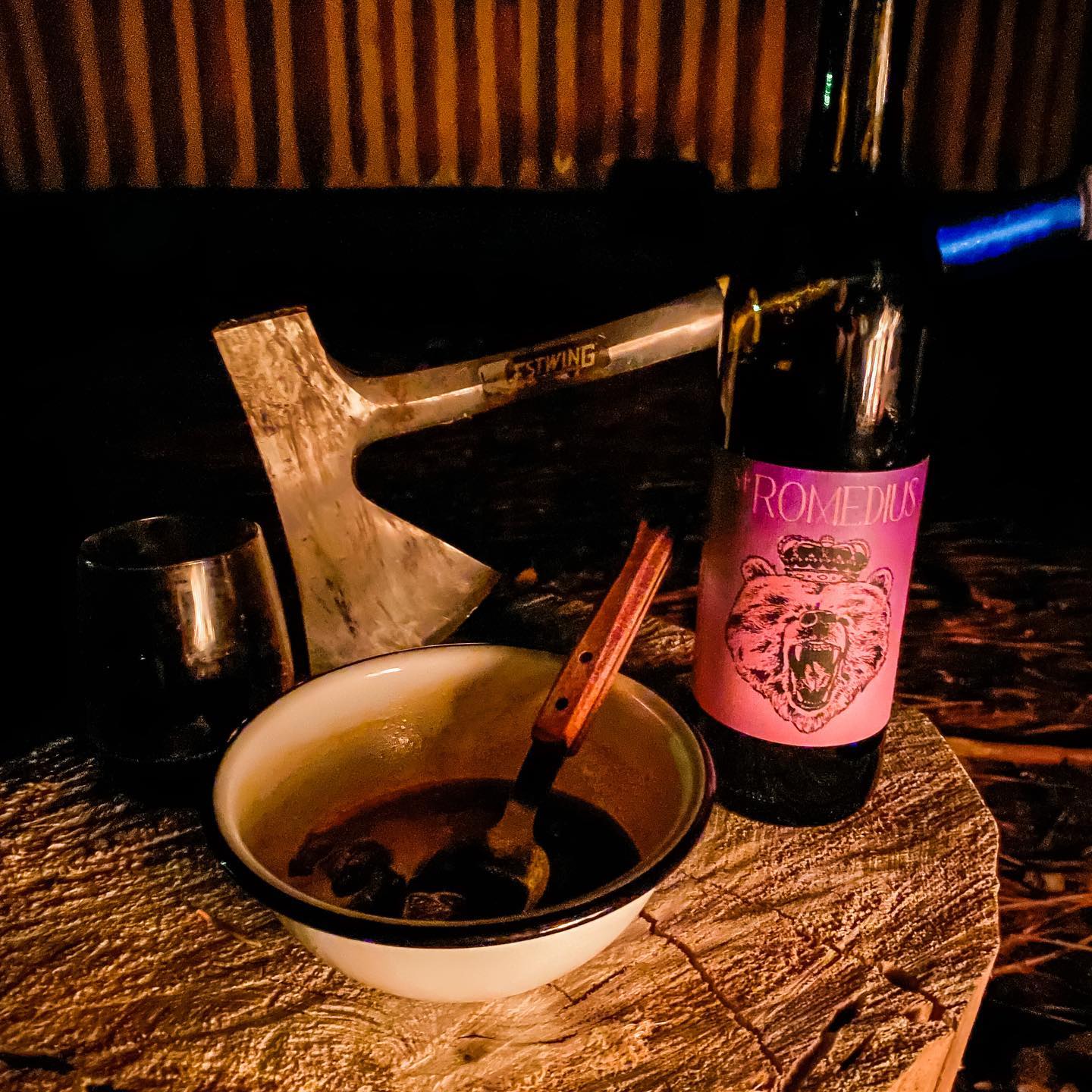 St. Romedius Teroldego wine in a low-light setting.