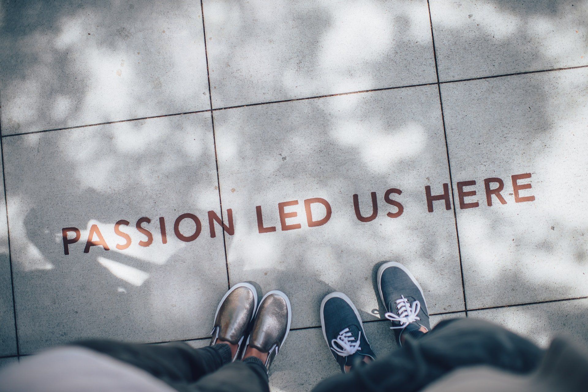 passion led us here text on the ground