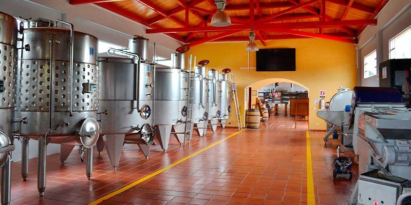 Inside a winery where wine is made: stainless steel tanks and equipment Inside a winery where wine is made: stainless steel tanks and equipment