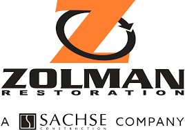 Logo for Zolman Restoration, a Sachse Company, featuring a large orange 'Z' stylized with a black circular arrow.
