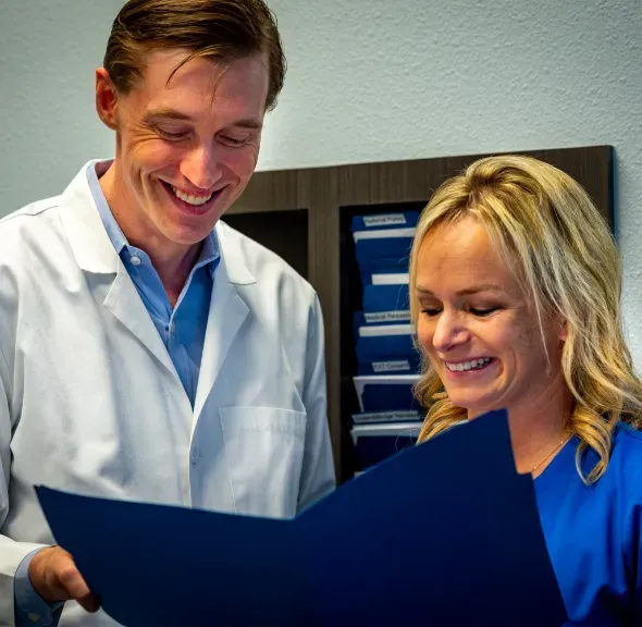 travis campbell dentist | talking to patient | Garland TX 75040