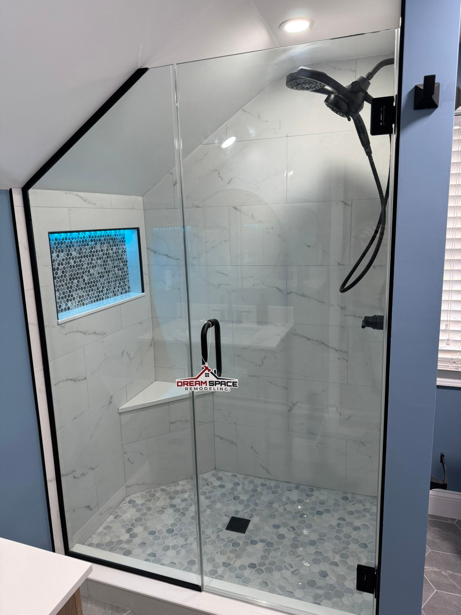 Frameless glass walk-in shower with LED niche in Reisterstown, MD