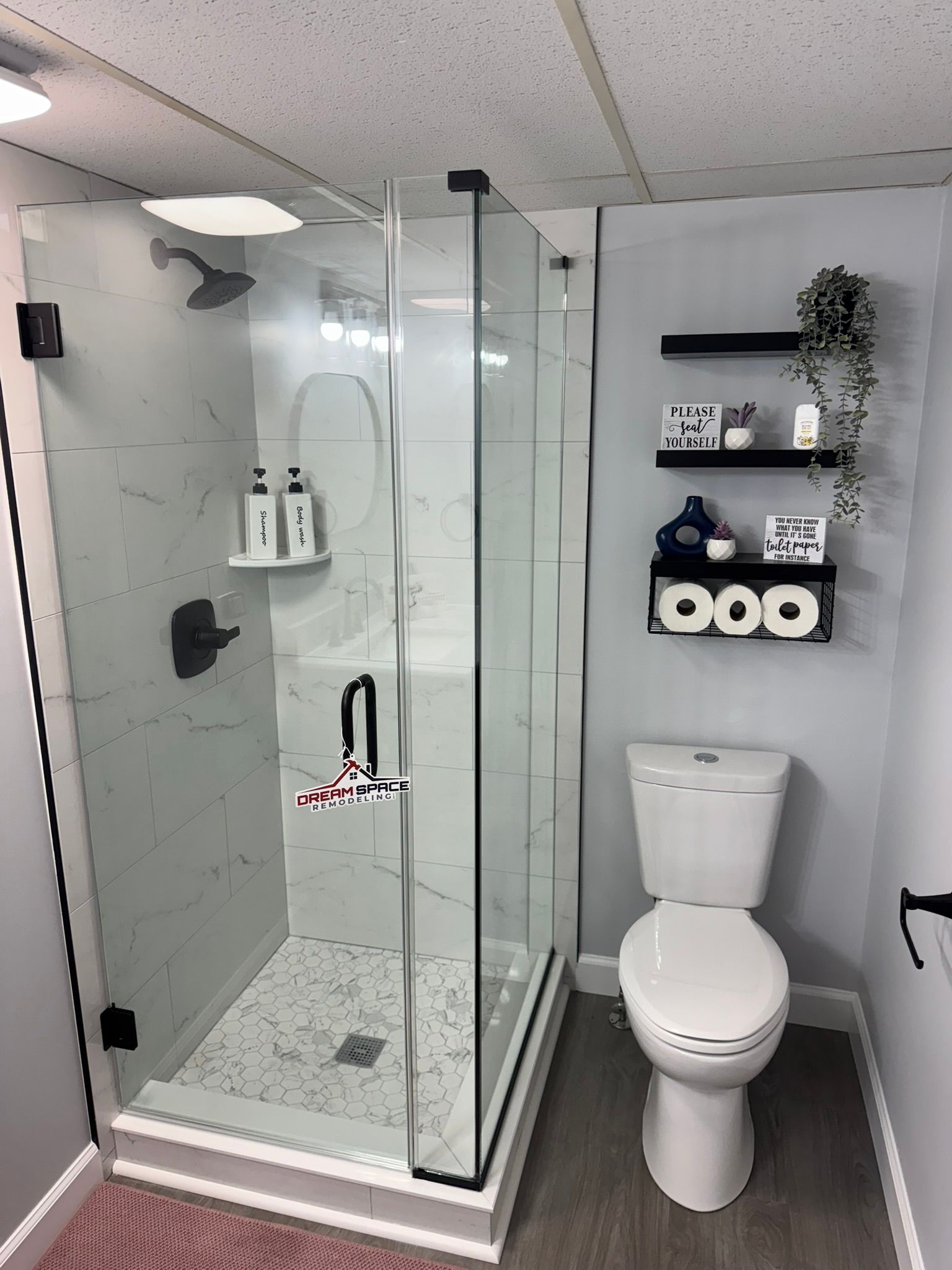 Modern small basement bathroom with 30x30 shower and clear glass shower door | Westminster, MD