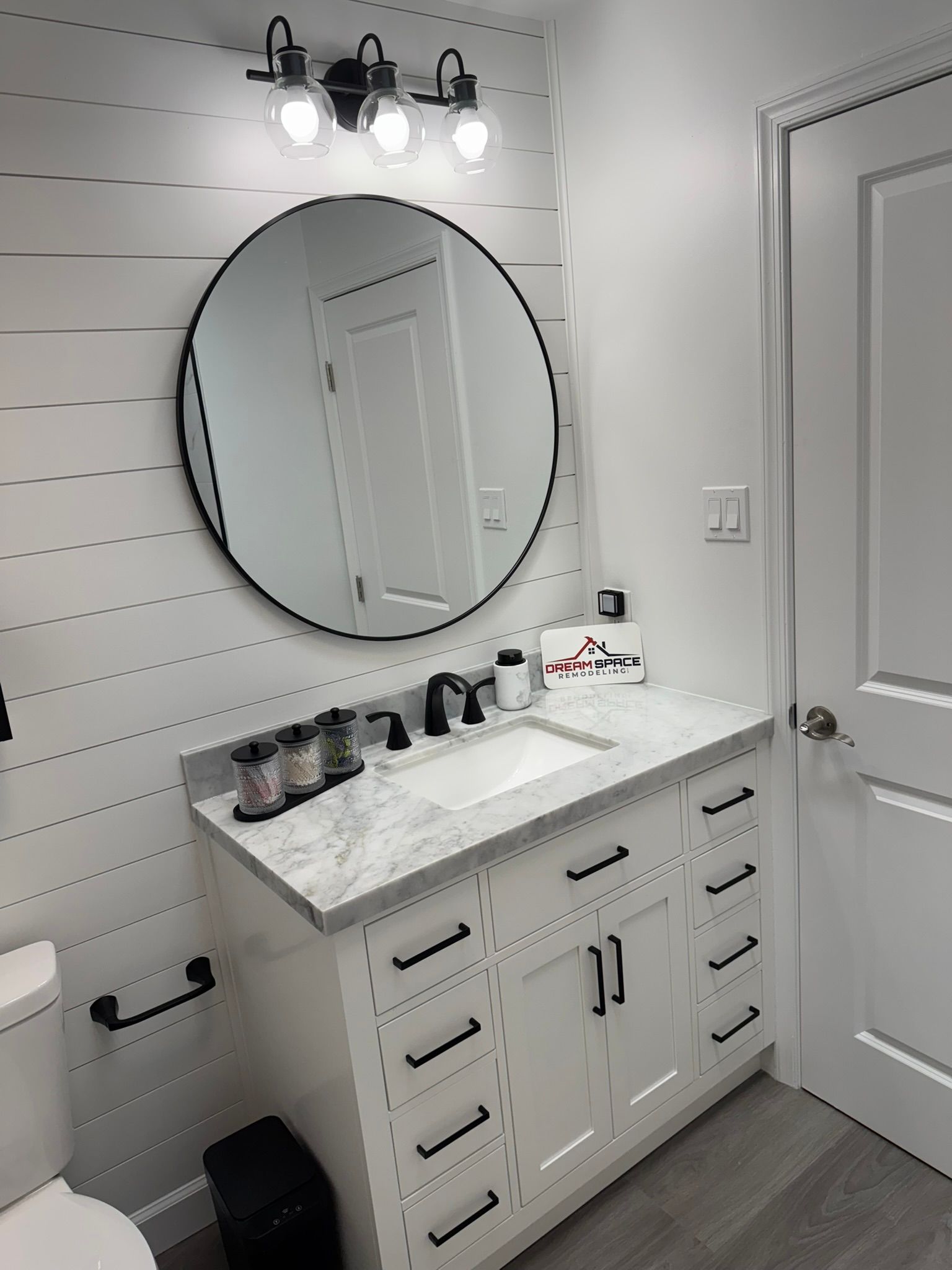Small bathroom renovation featuring shiplap accent wall in Manchester, MD